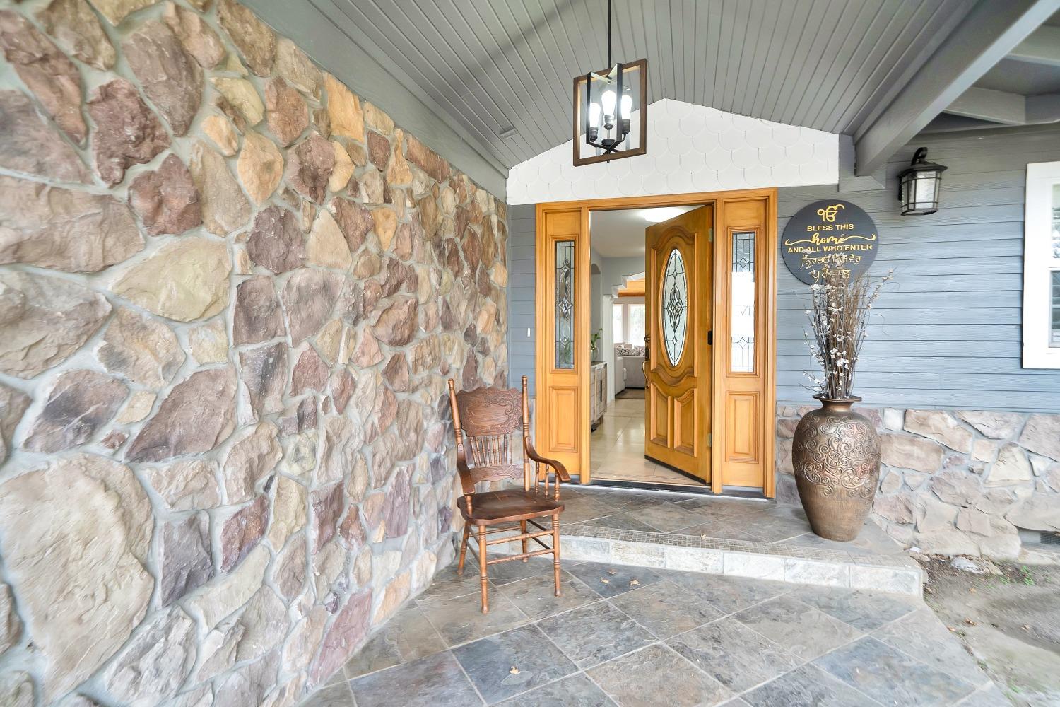 5420 East Jahant Road Galt, CA 95632 - Photo 14 of 73 a view of entrance with wooden floor and a chandelier