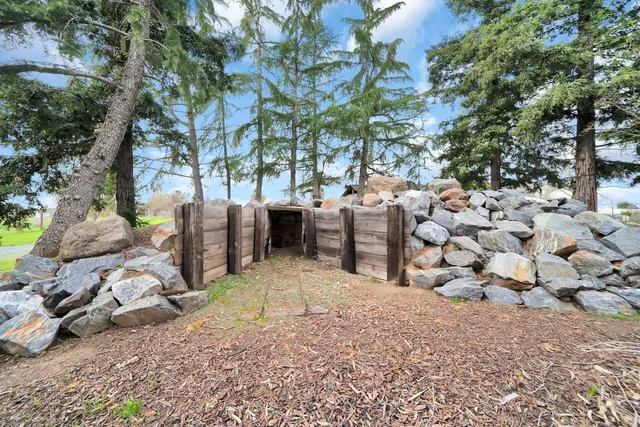 a kitchen with a sink and a stove top oven
