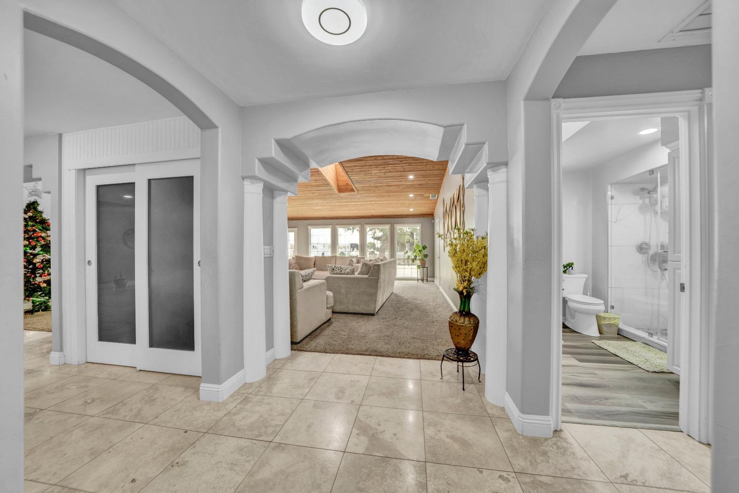 5420 East Jahant Road Galt, CA 95632 - Photo 36 of 73 a view of a hallway with wooden floor and living room
