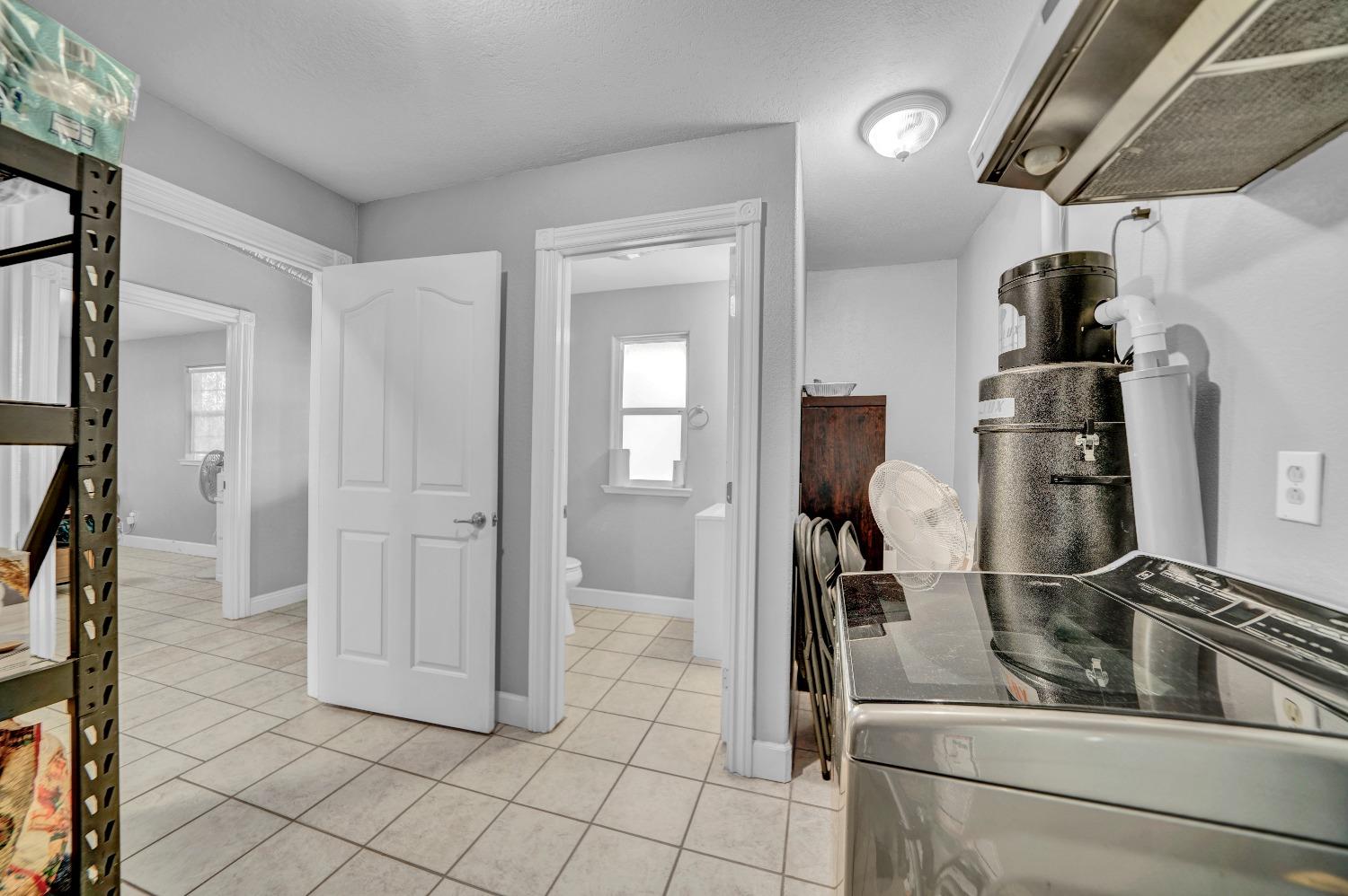 5420 East Jahant Road Galt, CA 95632 - Photo 48 of 73 a kitchen with refrigerator and cabinets