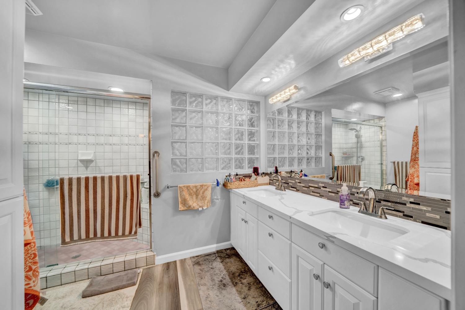 5420 East Jahant Road Galt, CA 95632 - Photo 68 of 73 a bathroom with a double vanity sink mirror and double