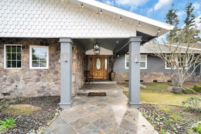 a street view with large trees