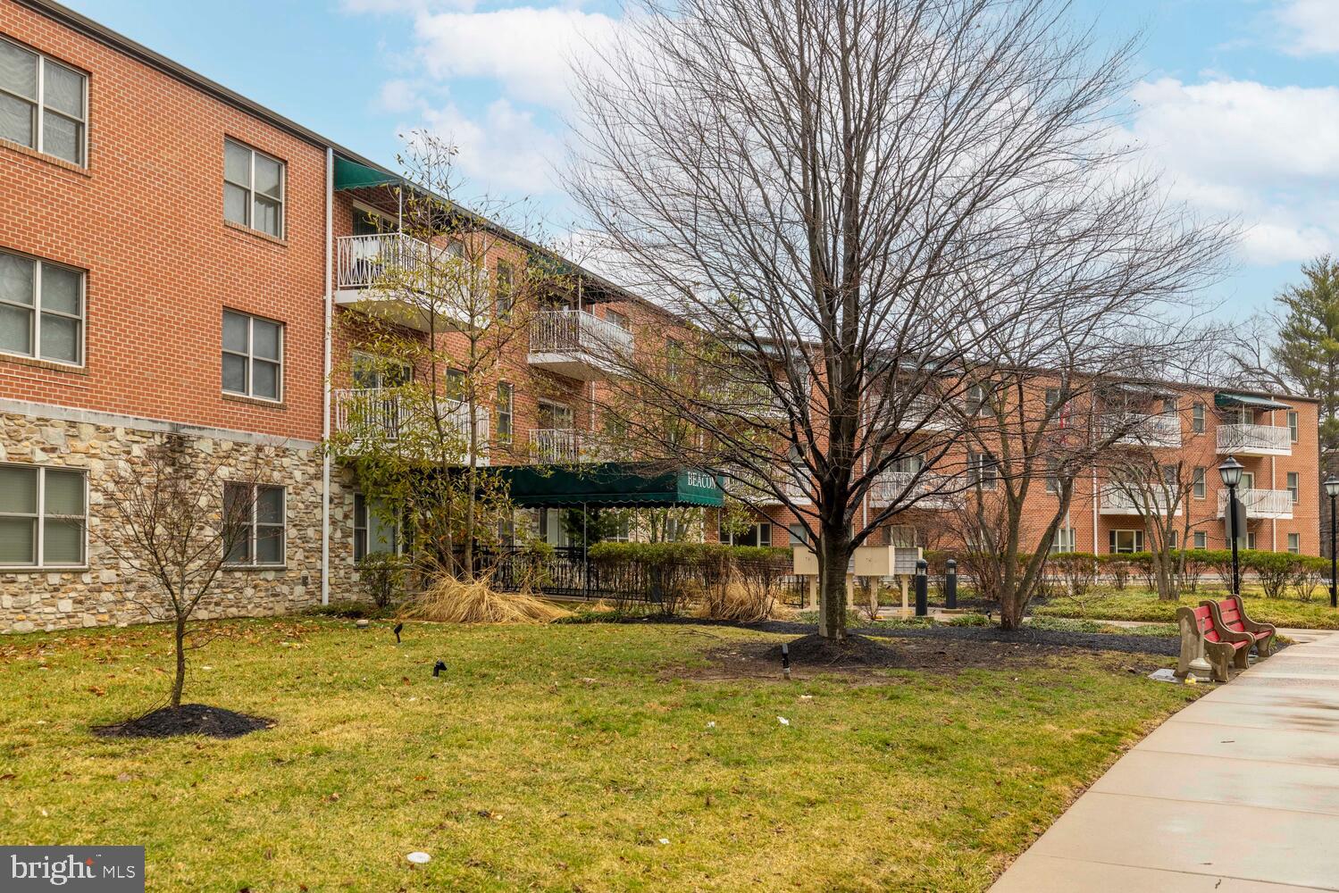 1600 Church Road, Unit D205 Wyncote, PA 19095 - Photo 18 of 21 a swimming pool with outdoor seating and yard