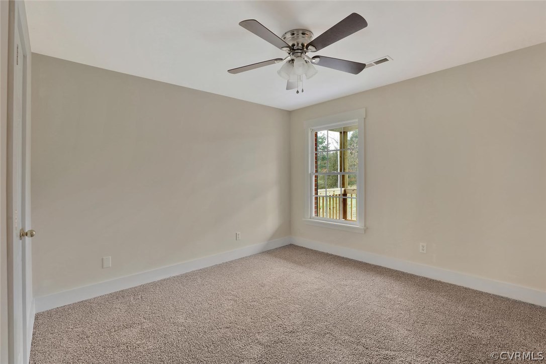 6053 Miles Road Powhatan, VA 23139 - Photo 19 of 25 Master #2 on first floor. Bathroom has tub/shower.
