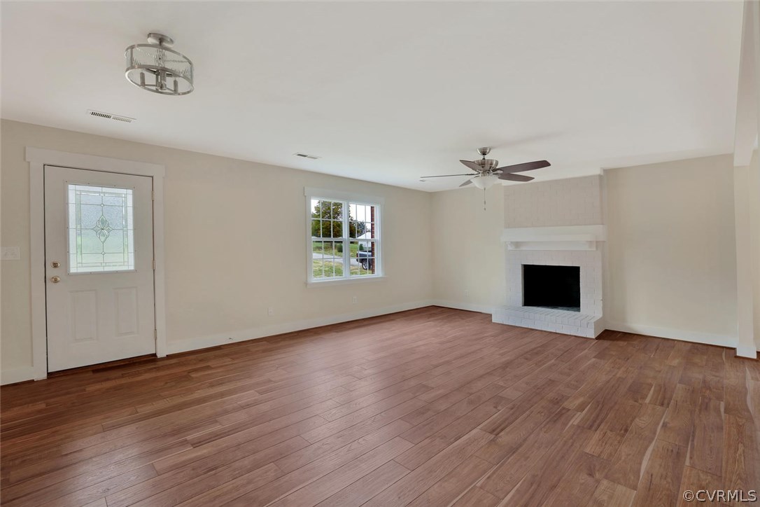 6053 Miles Road Powhatan, VA 23139 - Photo 5 of 25 Family room with wood burning fireplace. All commo