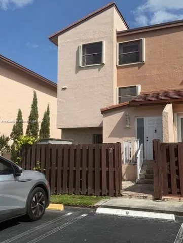 a car parked in front of a house