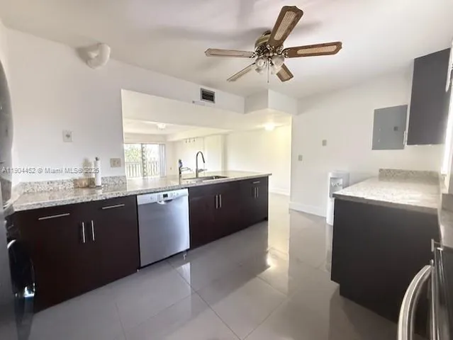a large kitchen with a cabinets and a sink