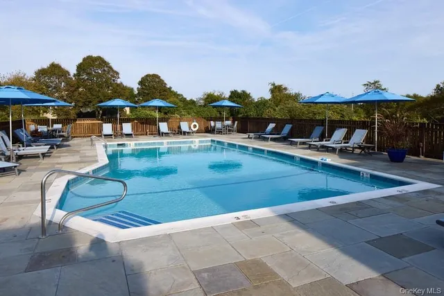 a view of a swimming pool with lounge chairs