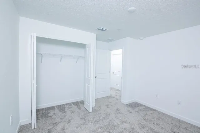 a view of a house with outdoor space and sitting area