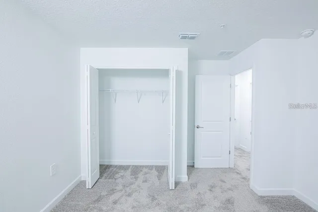 a view of a park with swings and slides