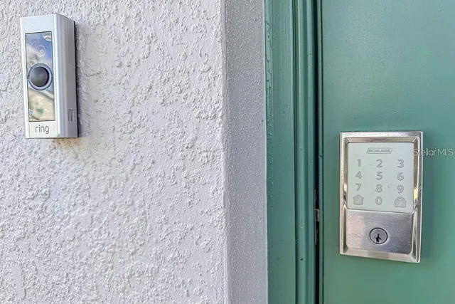 a view of kitchen with wooden floor and electronic appliances