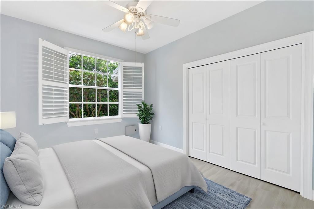 4995 Marsh Turtle Trail, Unit 102 Estero, FL 33928 - Photo 20 of 42 a bedroom with a large bed and a window