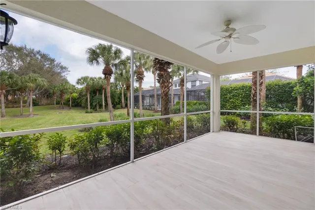 a view of a house with a big yard and potted plants