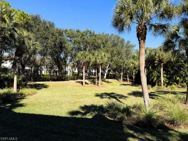 a view of a swimming pool with an outdoor space and seating area
