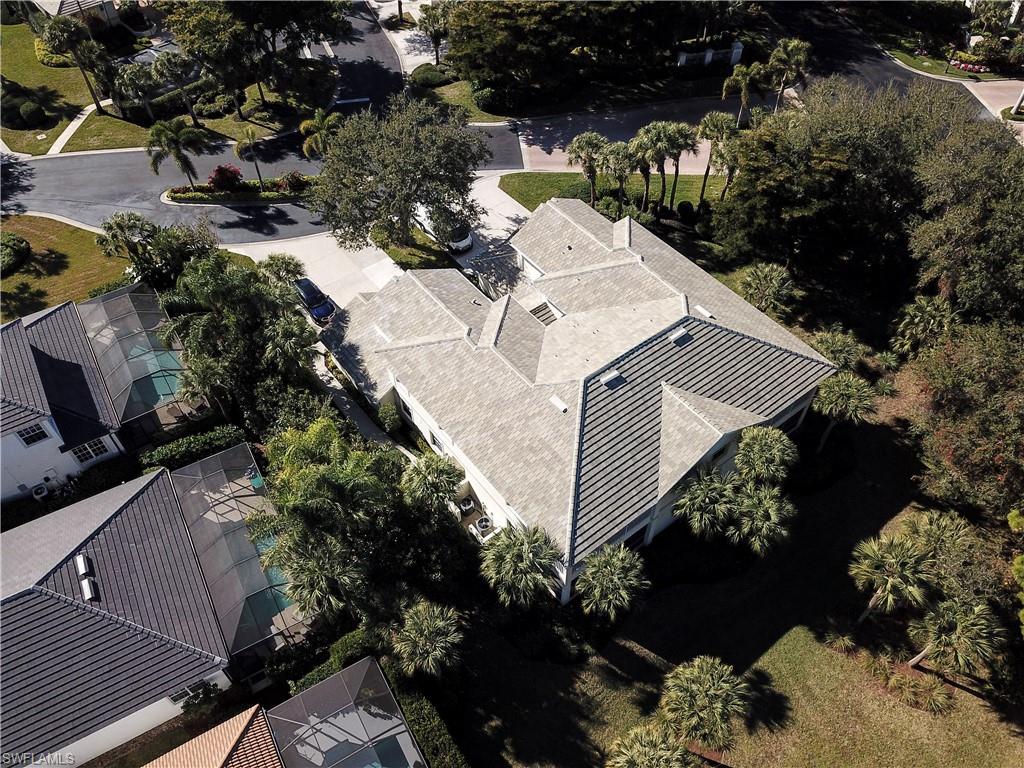 4995 Marsh Turtle Trail, Unit 102 Estero, FL 33928 - Photo 27 of 42 a view of a yard with yellow house