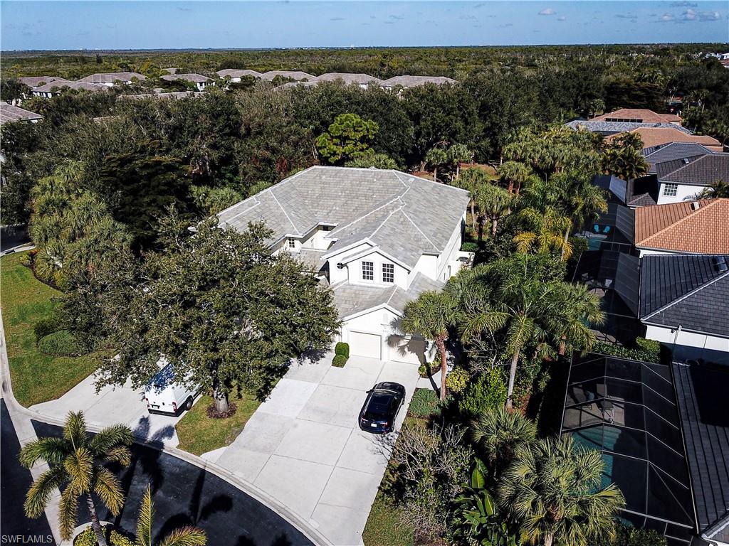 4995 Marsh Turtle Trail, Unit 102 Estero, FL 33928 - Photo 28 of 42 an aerial view of a house with a yard