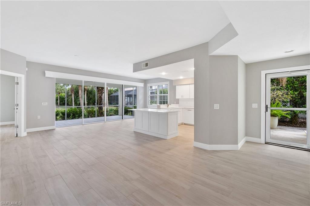 4995 Marsh Turtle Trail, Unit 102 Estero, FL 33928 - Photo 5 of 42 a view of an empty room with a window