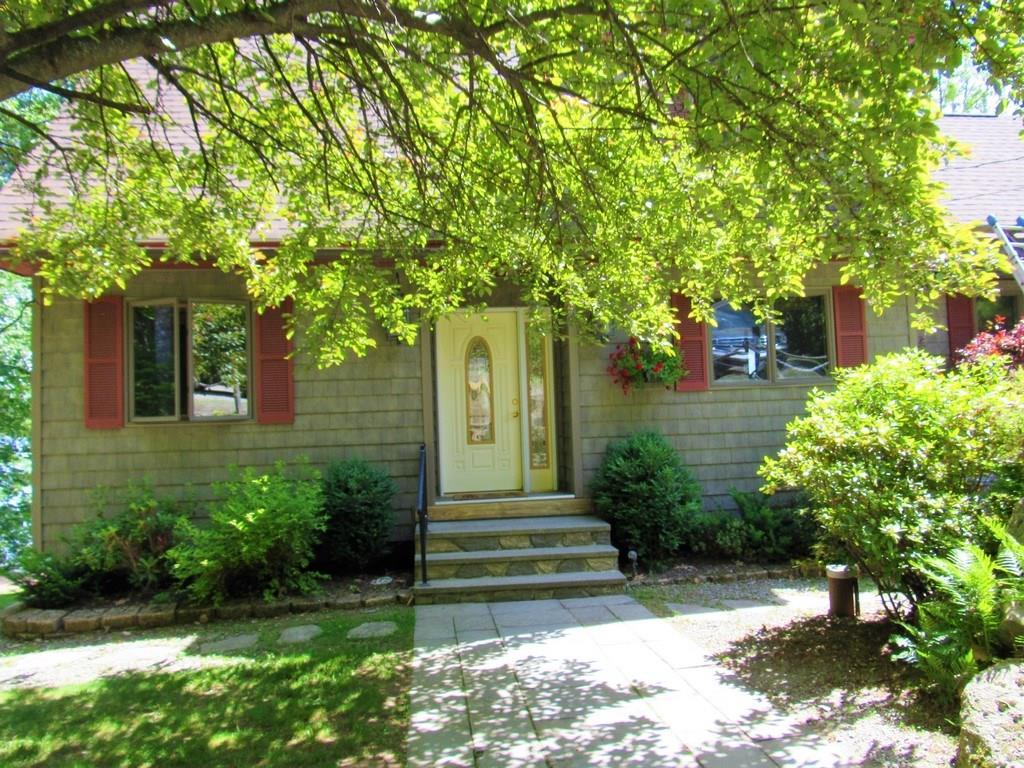 427 Lakeview Avenue Dedham, ME 04429 - Photo 2 of 35 Lush, mature landscaping frame this...
