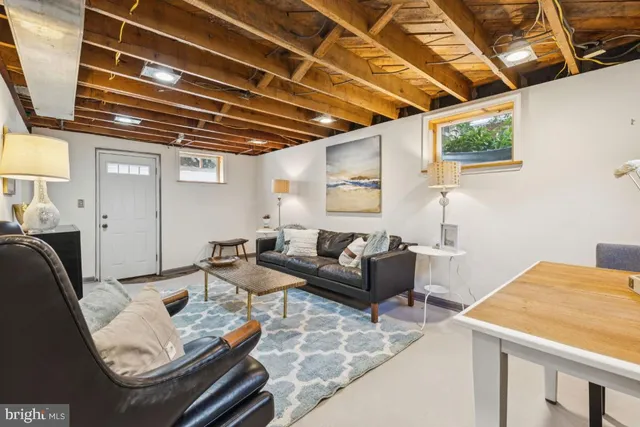 a living room with furniture and a table