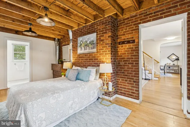 a bedroom with a bed and a walk in closet