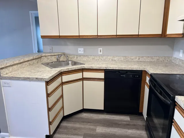 a kitchen with a sink and cabinets