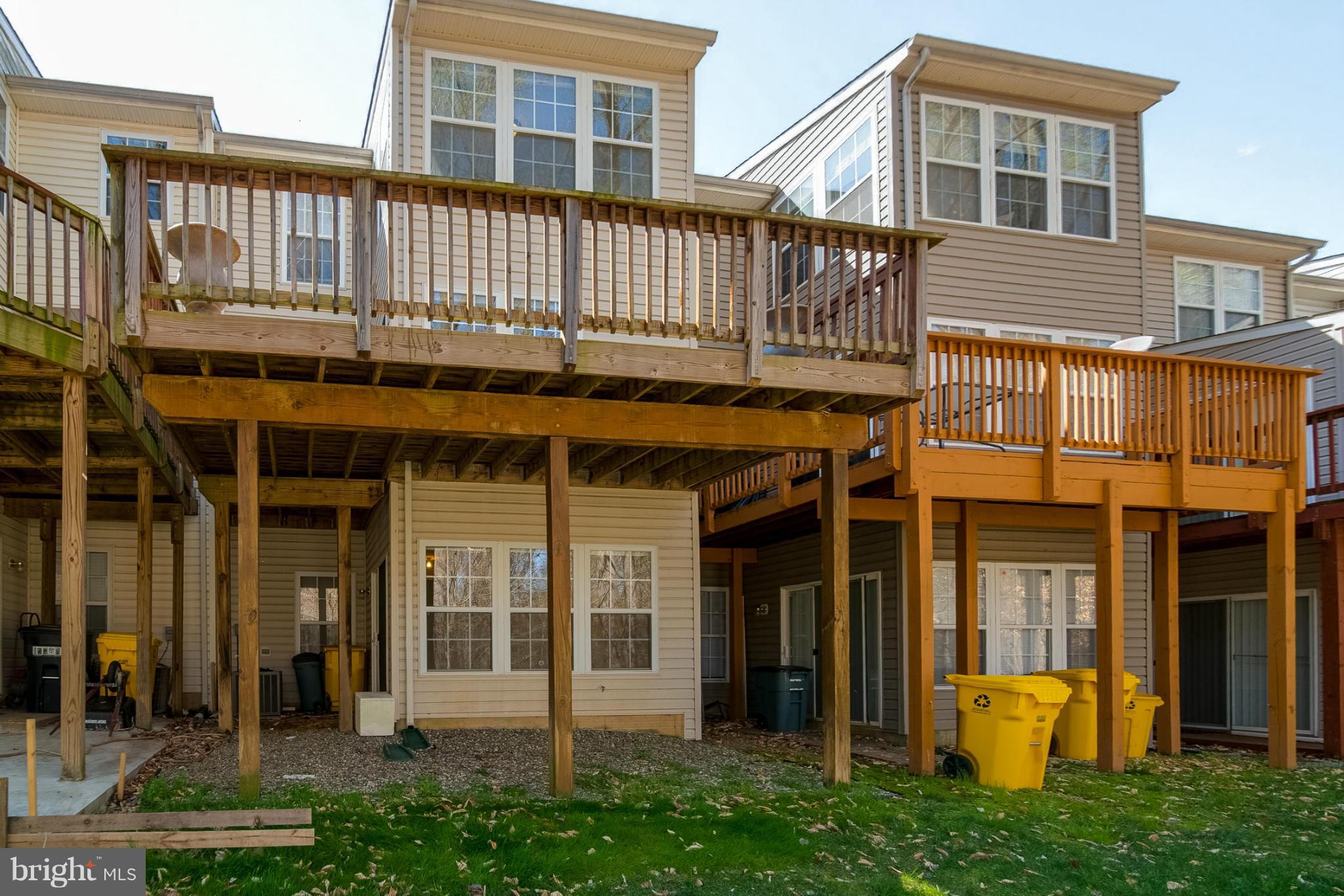 8103 Pennington Drive Laurel, MD 20724 - Photo 13 of 14 a front view of a house with barbeque and stairs