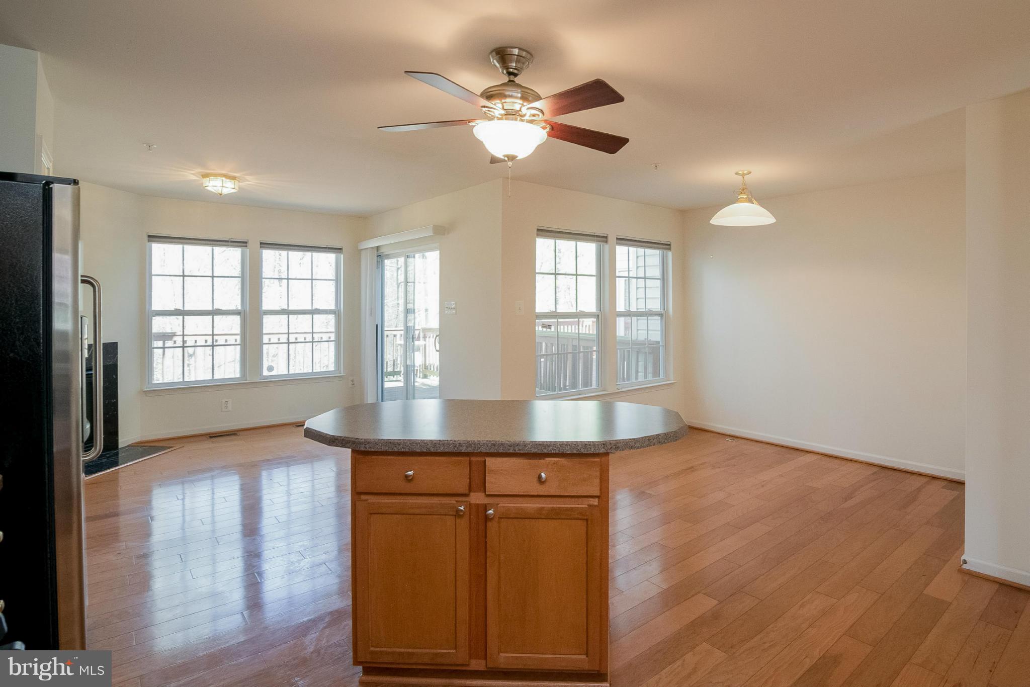 8103 Pennington Drive Laurel, MD 20724 - Photo 5 of 14 wooden floor in an empty room with a window