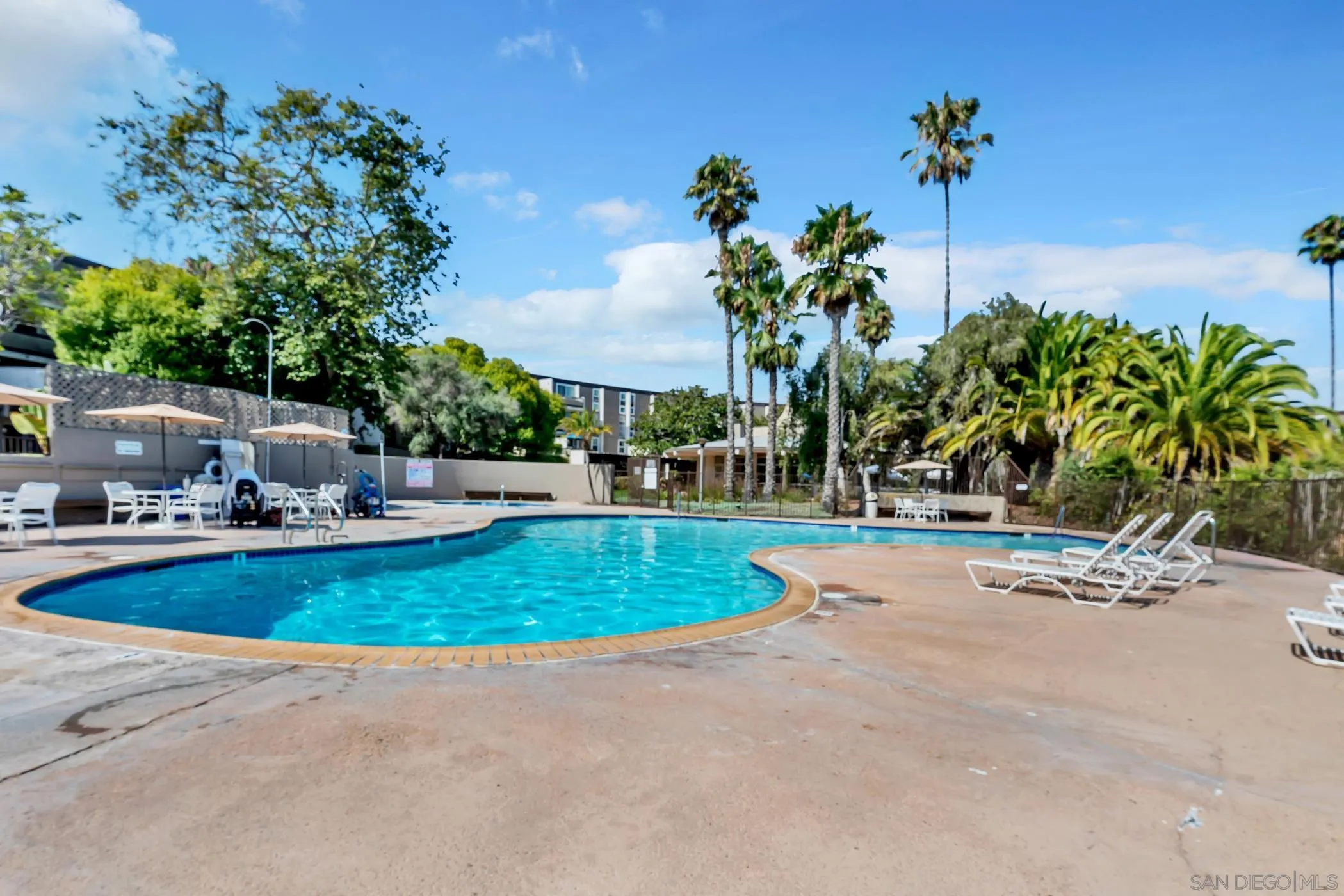 3050 Rue D’Orleans, Unit 461 San Diego, CA 92110 - Photo 15 of 23 a view of a backyard with swimming pool