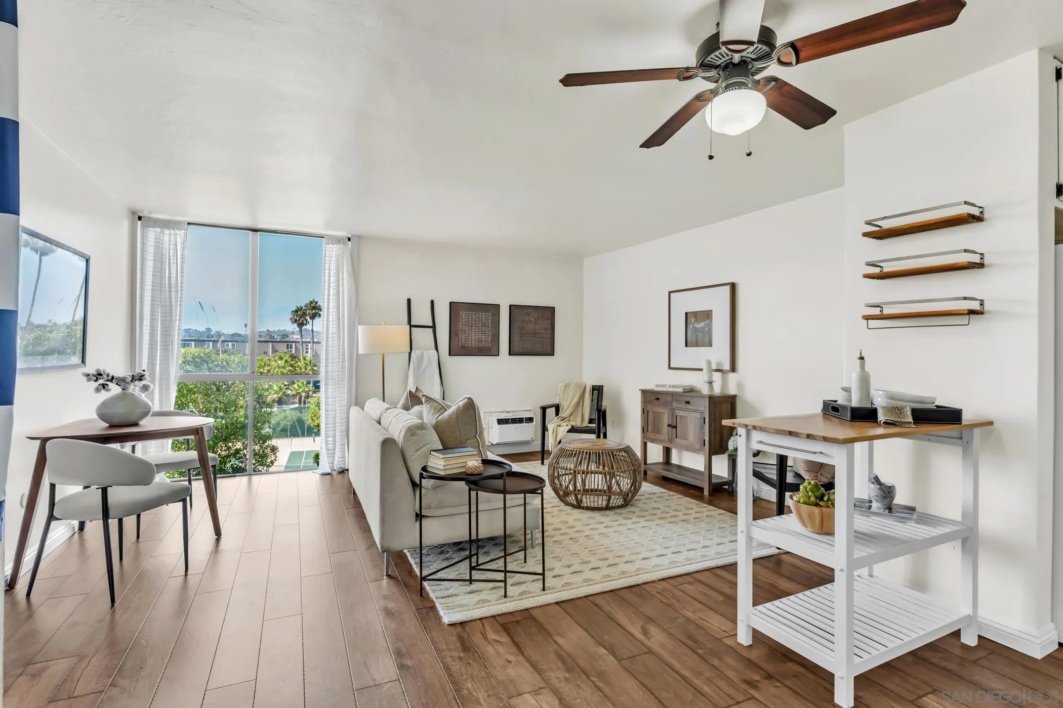 3050 Rue D’Orleans, Unit 461 San Diego, CA 92110 - Photo 2 of 23 a living room with furniture and a wooden floor
