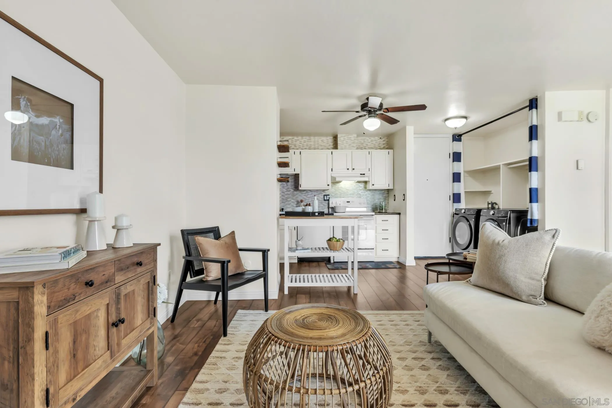 3050 Rue D’Orleans, Unit 461 San Diego, CA 92110 - Photo 4 of 23 a living room with stainless steel appliances kitchen island a table and chairs