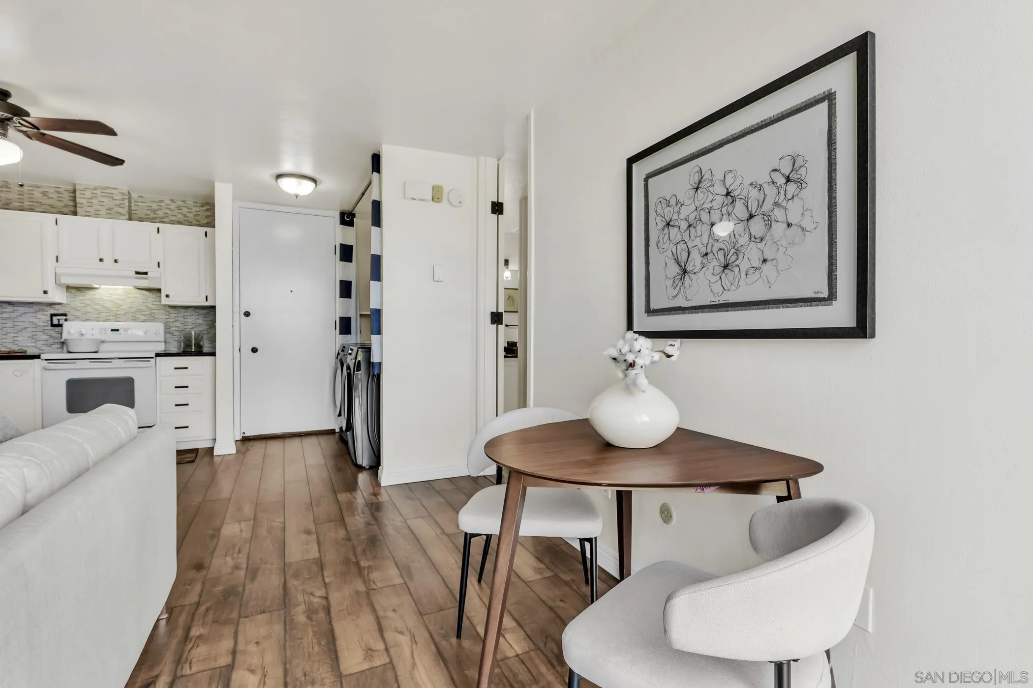 3050 Rue D’Orleans, Unit 461 San Diego, CA 92110 - Photo 5 of 23 a view of a dining room with furniture and wooden floor