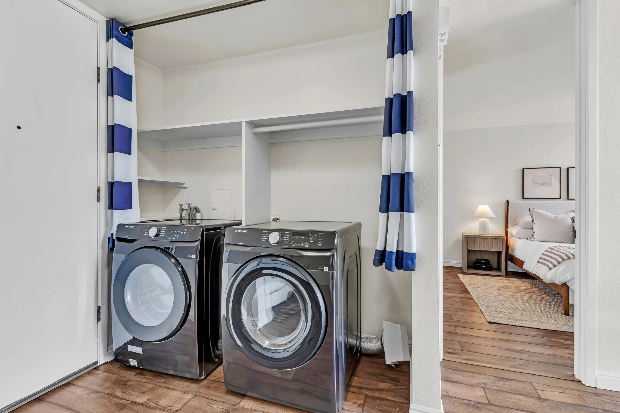 3050 Rue D’Orleans, Unit 461 San Diego, CA 92110 - Photo 7 of 23 a view of living room washer and dryer