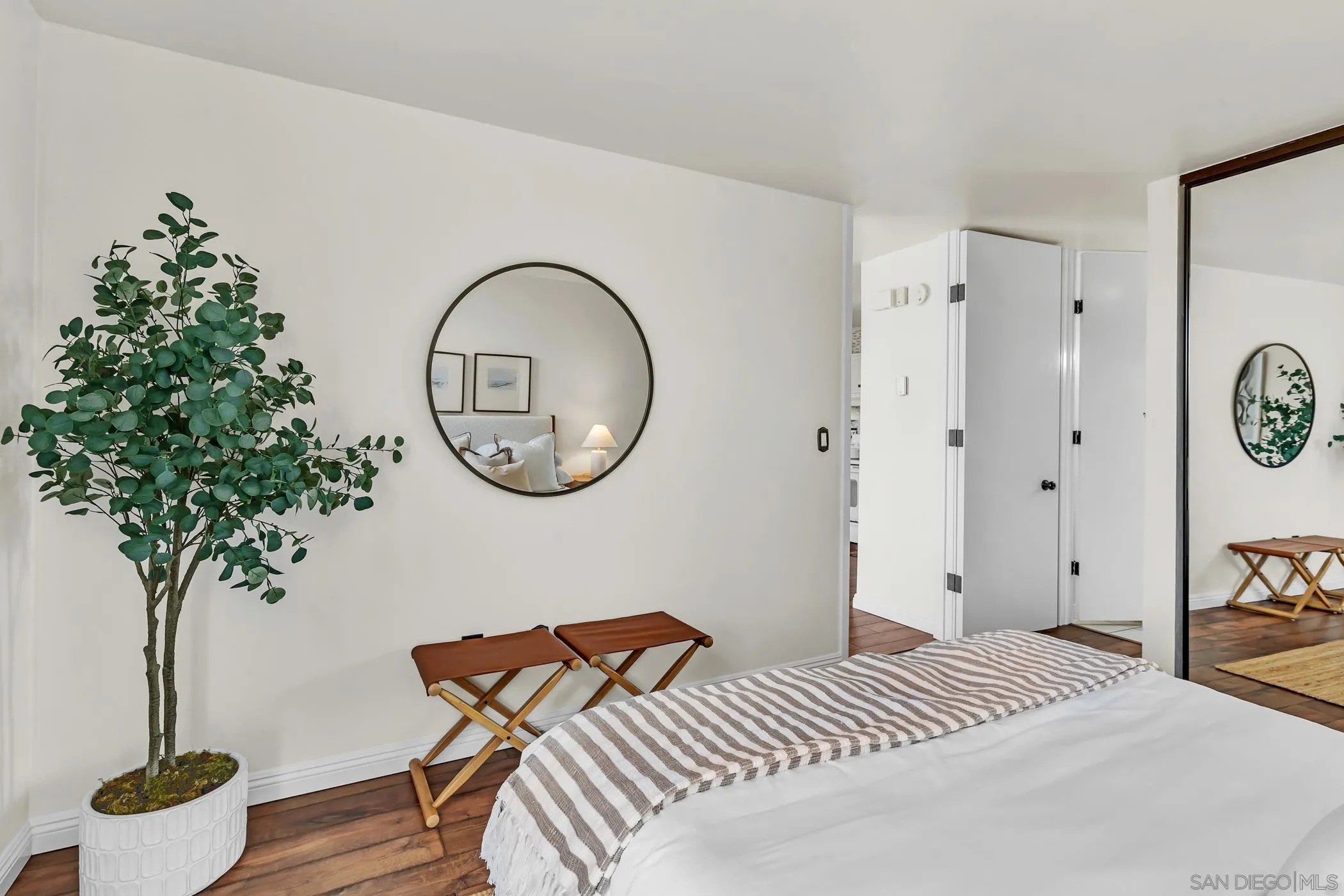 3050 Rue D’Orleans, Unit 461 San Diego, CA 92110 - Photo 8 of 23 a bedroom with bed and a potted plant