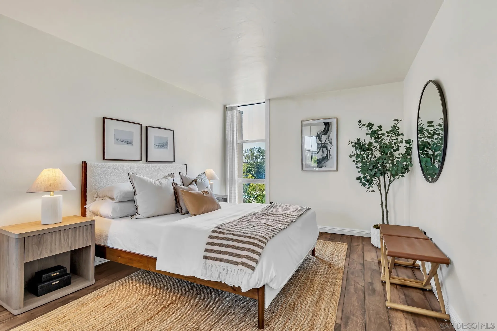 3050 Rue D’Orleans, Unit 461 San Diego, CA 92110 - Photo 10 of 23 a bedroom with a bed and a chandelier