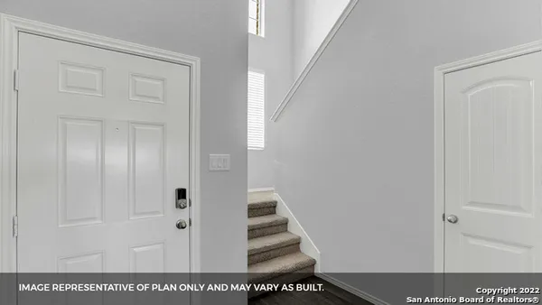 a view of staircase with white walls