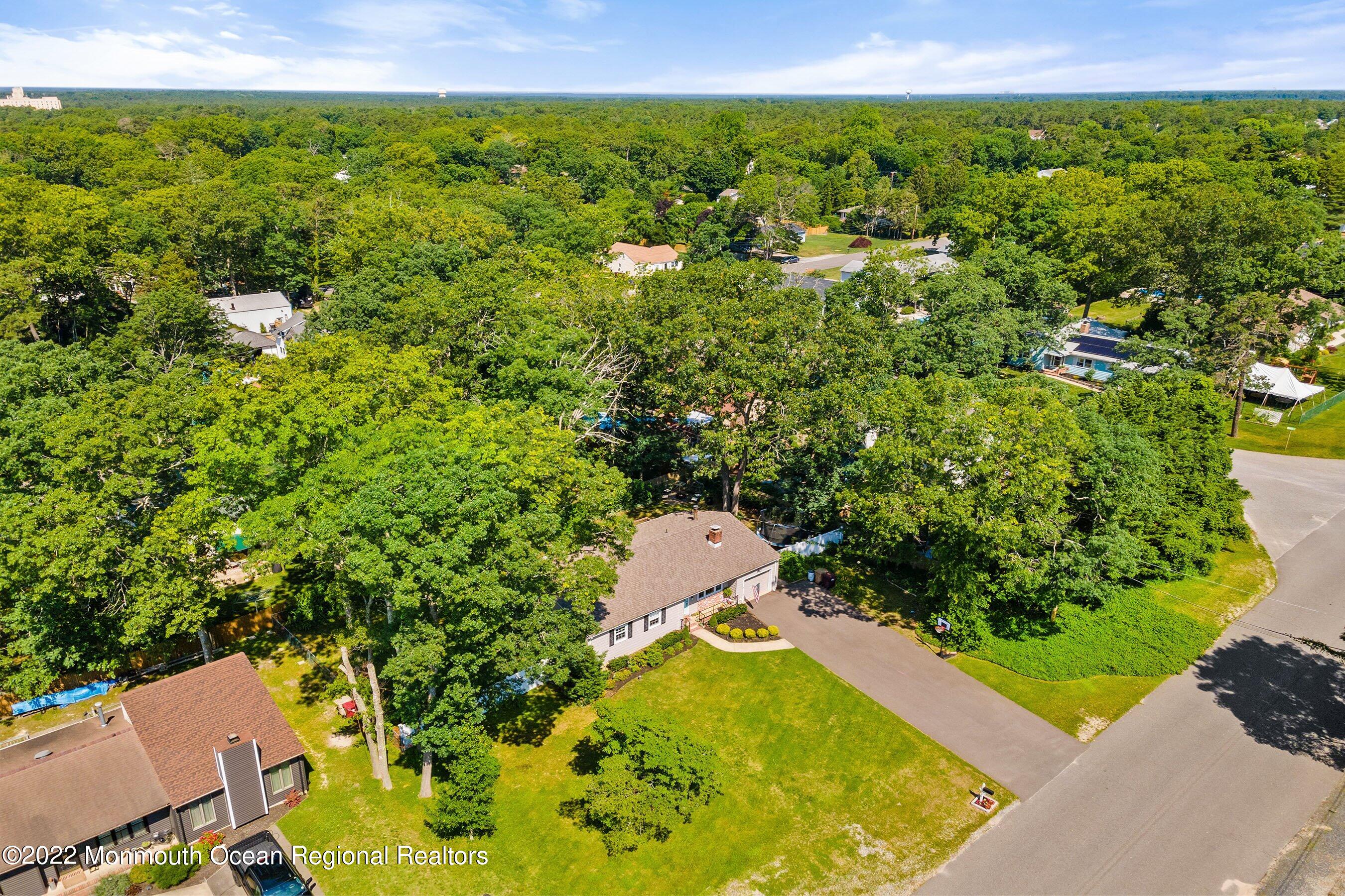 424 Eastern Boulevard Bayville, NJ 08721 - Photo 22 of 24 a view of a yard with an outdoor space and seating area