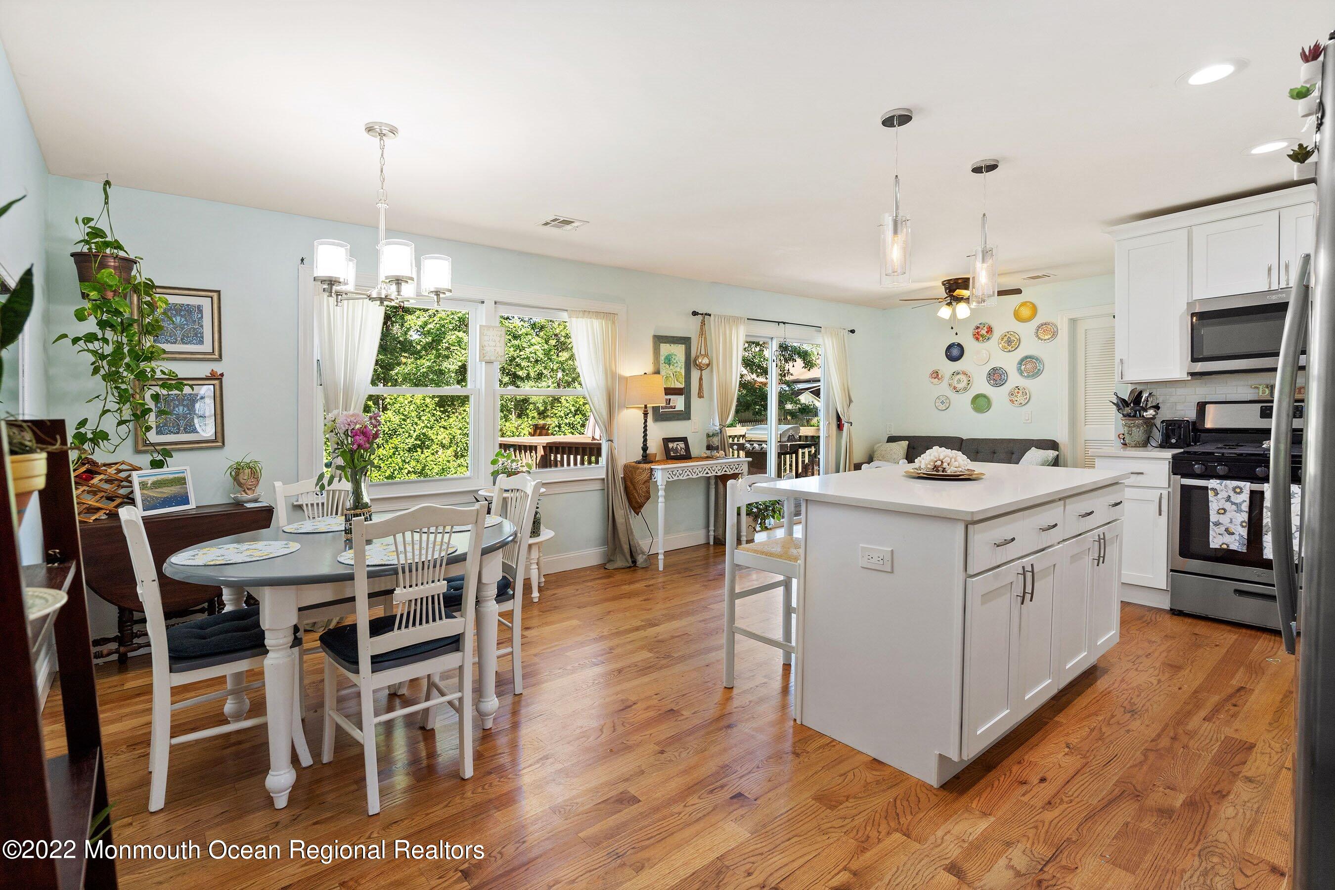 424 Eastern Boulevard Bayville, NJ 08721 - Photo 6 of 24 a kitchen that has a lot of white cabinets and stainless steel appliances