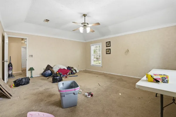 a room with a toys and ceiling fan
