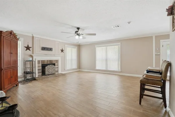 a view of a livingroom with furniture and a fireplace
