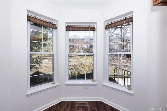 a view of front door and deck of a house