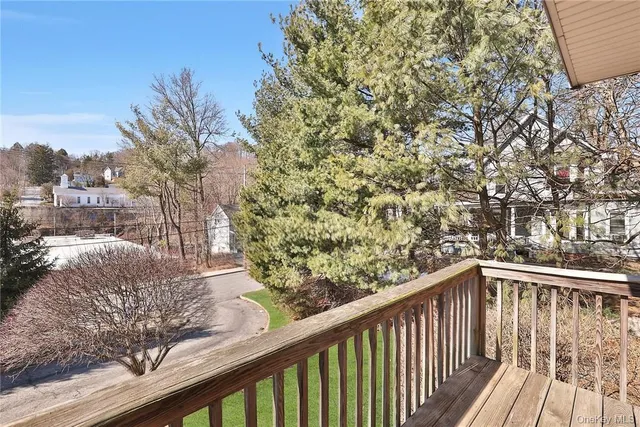 a view of a balcony with wooden fence