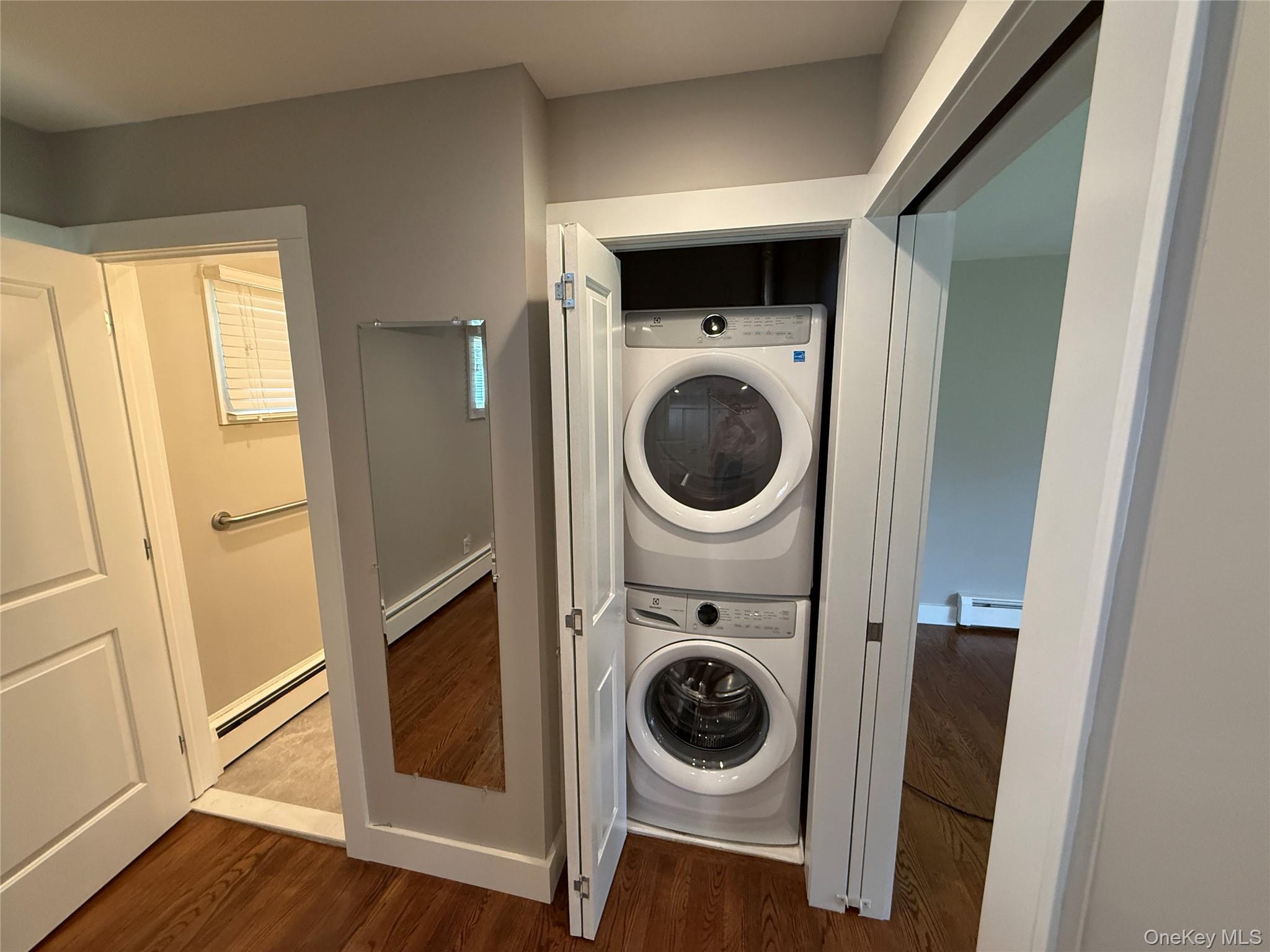 55075 Main Road, Unit YOUNGS BLDG #3 Southold, NY 11971 - Photo 6 of 16 a utility room with dryer and washer