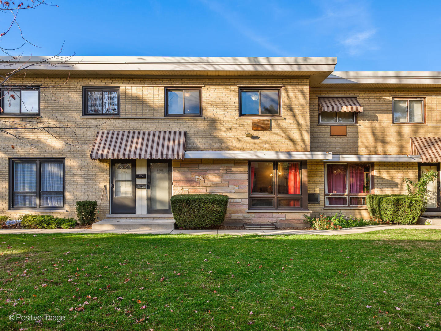 958 North Wheeling Road Mount Prospect, IL 60056 - Photo 1 of 17 a front view of a house with a yard