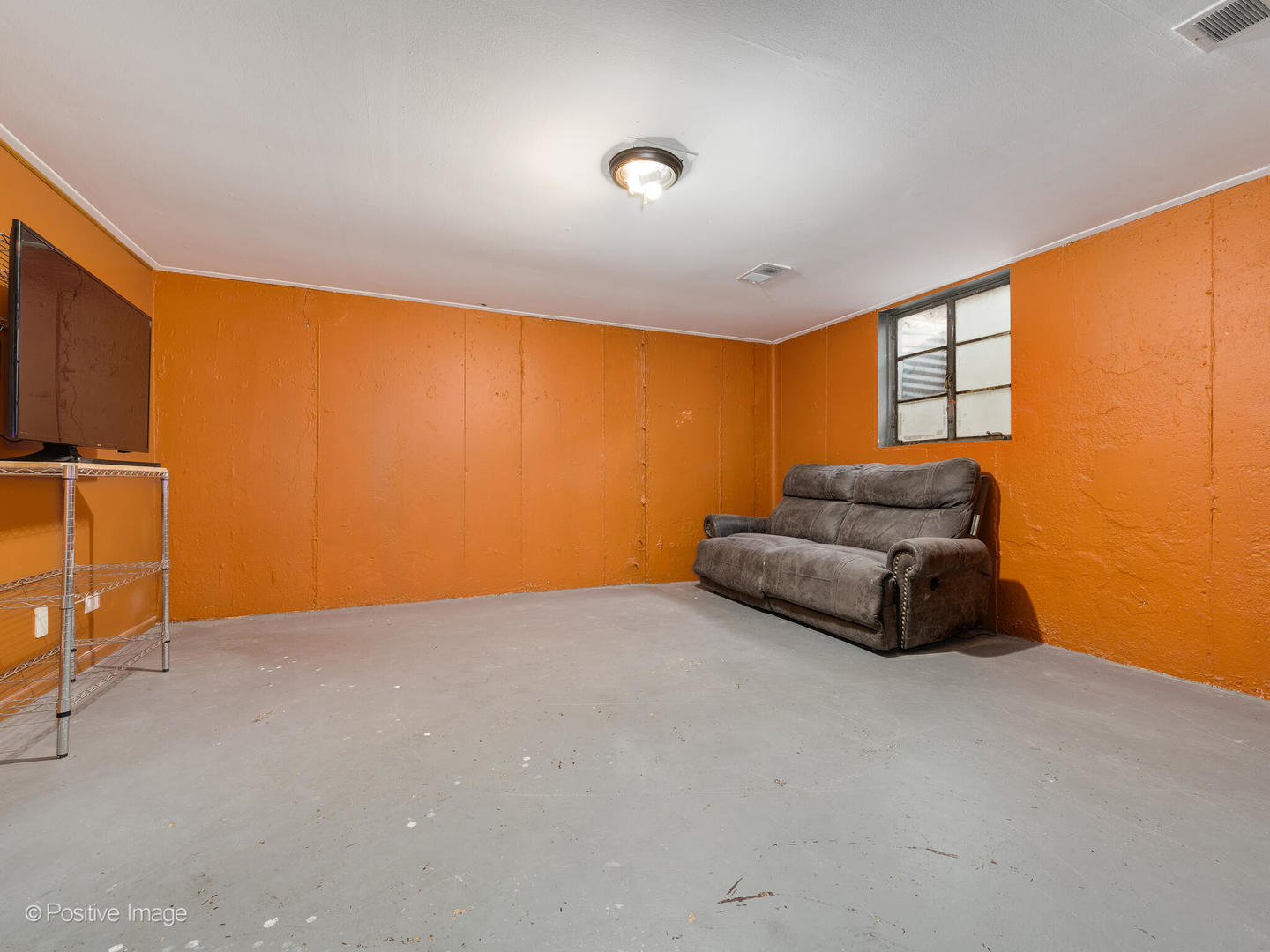 958 North Wheeling Road Mount Prospect, IL 60056 - Photo 13 of 17 a living room with furniture and a flat screen tv