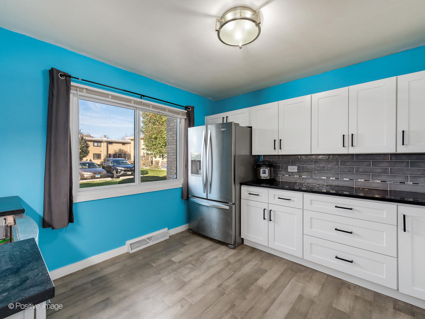 958 North Wheeling Road Mount Prospect, IL 60056 - Photo 5 of 17 a kitchen with granite countertop stainless steel appliances a stove and a refrigerator
