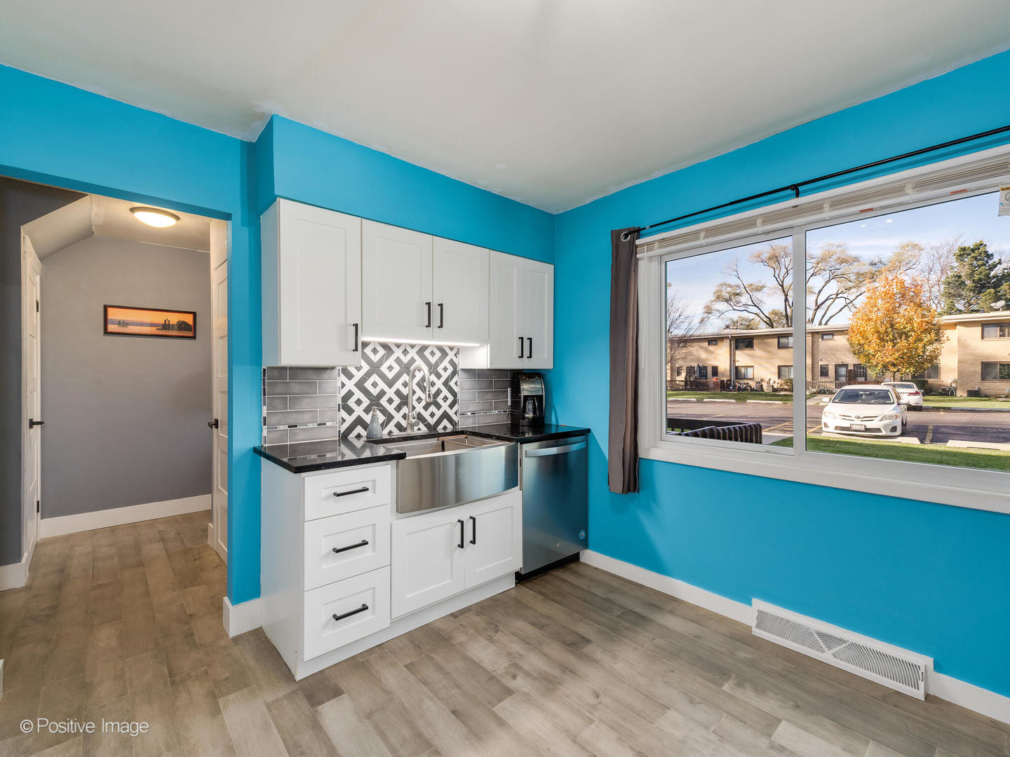 958 North Wheeling Road Mount Prospect, IL 60056 - Photo 6 of 17 a kitchen with granite countertop a stove and a wooden floors