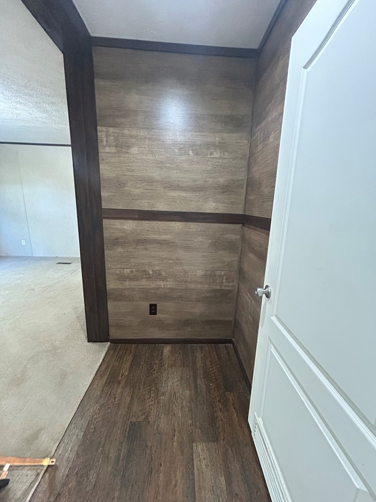 107 Oswichee Road Fort Mitchell, AL 36856 - Photo 13 of 56 a view of walk in closet with wooden floor