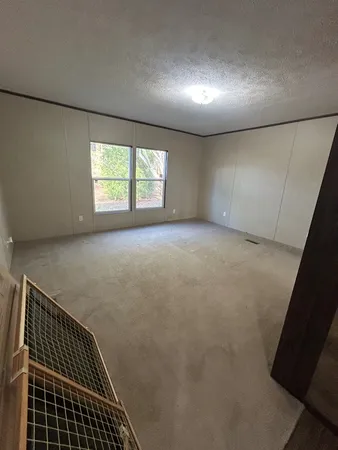 a view of an empty room with windows