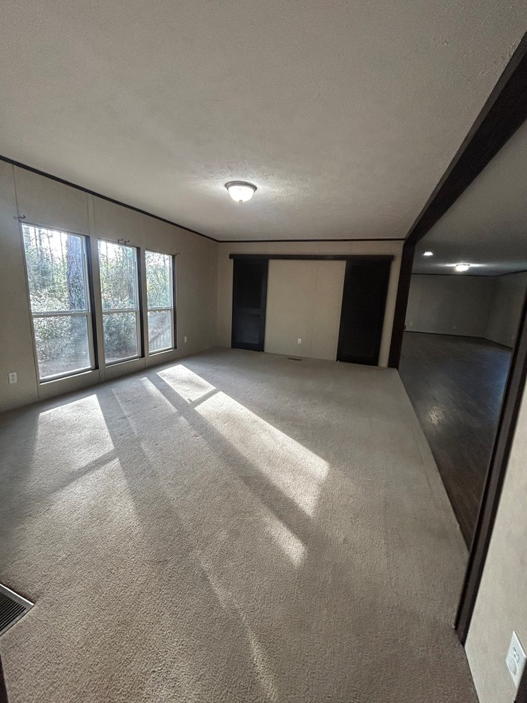 107 Oswichee Road Fort Mitchell, AL 36856 - Photo 15 of 56 a view of an empty room with windows