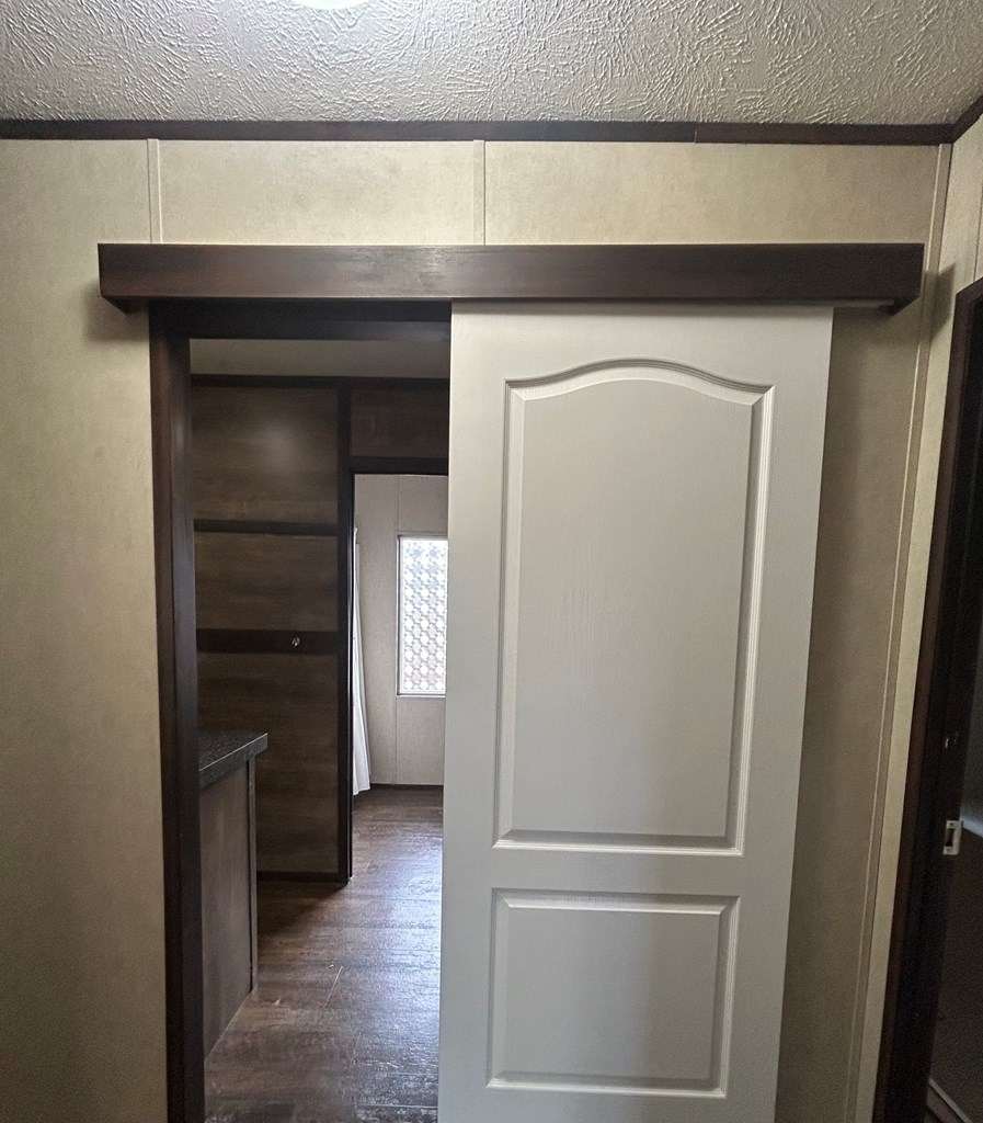 107 Oswichee Road Fort Mitchell, AL 36856 - Photo 24 of 56 a view of a hallway with wooden floor